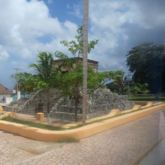 View of a small temple from a bus window