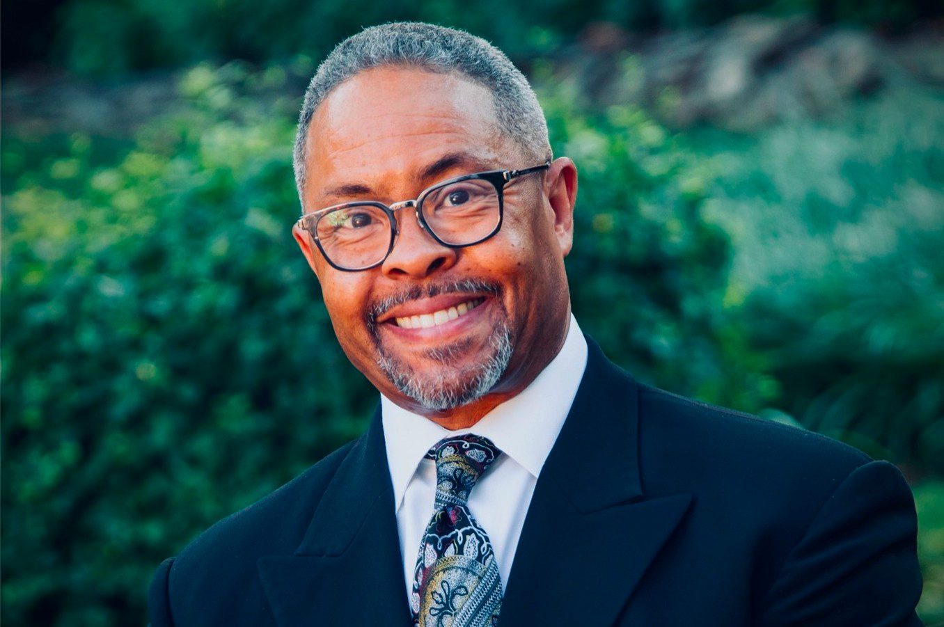 Headshot of Dr. Alyn E. Waller in a Blue Suit